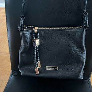 Medium sized black MK crossbody with gold hardware.